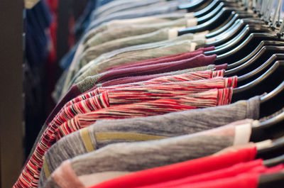 Close-up of clothes hanging on rack