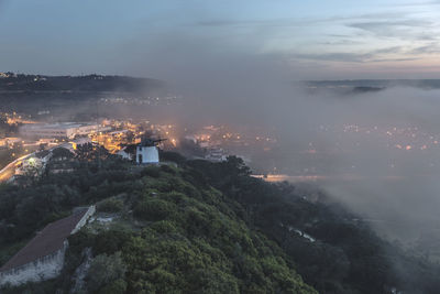 High angle view of cityscape against sky at dusk