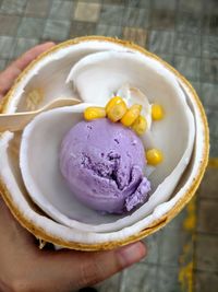 Close-up of hand holding ice cream