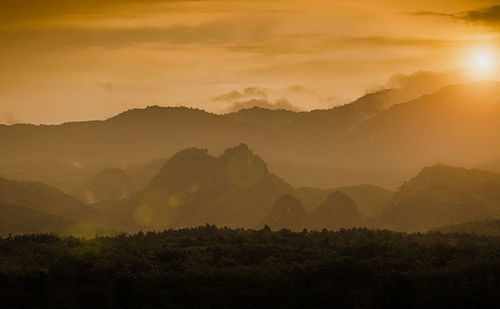 Scenic view of mountains against sky during sunset