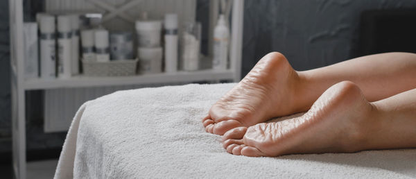 Woman foot spa massage treatment by professional massage therapist in spa resort. wellness, stress