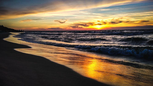 Scenic view of sea against sky during sunset