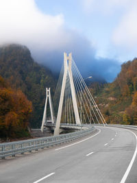 Bridge over road against sky