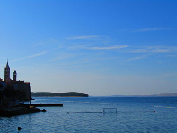 Scenic view of sea against blue sky
