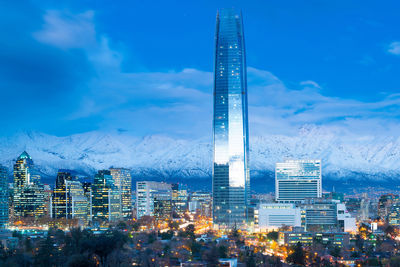 Skyline of financial district in las condes with los andes mountains in the back, santiago de chile