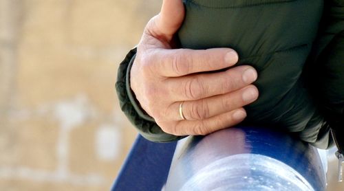 Close-up of man holding hands