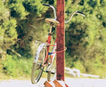 Bicycle locked on rusty metallic rod