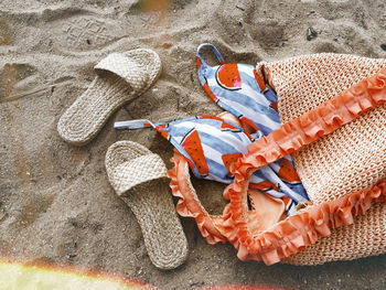 High angle view of shoes on beach