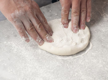 High angle view of person preparing food on table