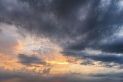 Low angle view of dramatic sky during sunset