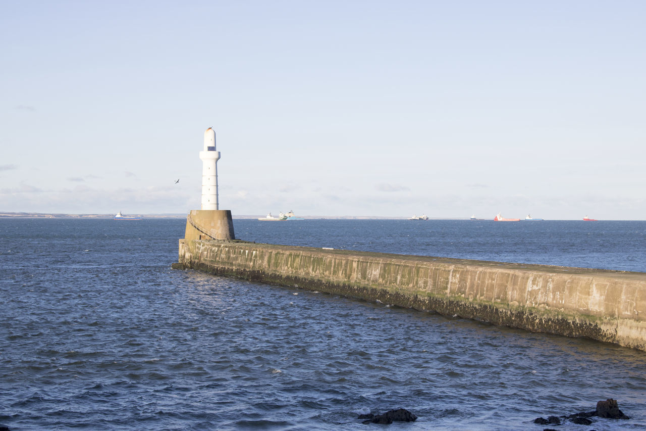 VIEW OF LIGHTHOUSE BY SEA AGAINST SKY