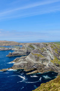 Aerial view of sea against blue sky