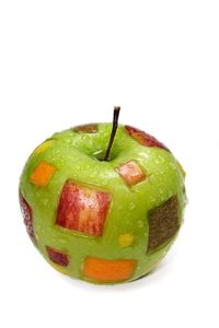 Close-up of fruit over white background