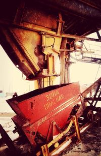 Interior of abandoned boat against sky