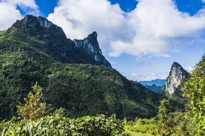 Scenic view of mountains against cloudy sky