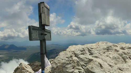 Low angle view of mountain range against sky