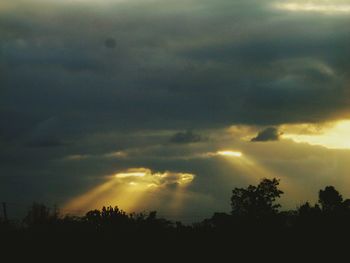 Scenic view of landscape against cloudy sky