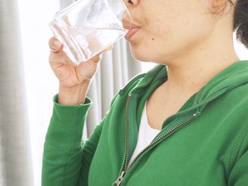 Close-up of man holding drink