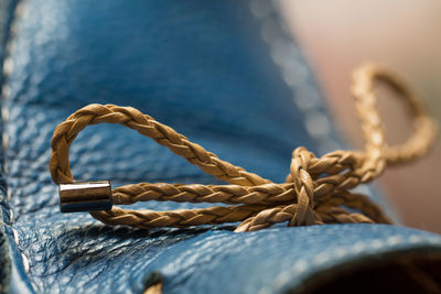 Close-up of tied knot on leather