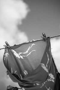 Low angle view of hanging against sky