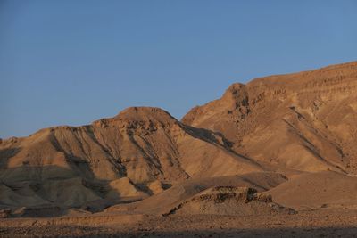 Scenic view of desert against clear sky