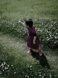 Full length of girl standing on grass