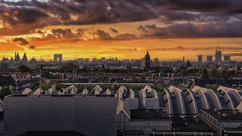 Cityscape against sky during sunset