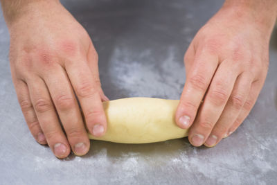 Close-up of person preparing food on table