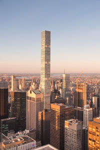 Modern buildings in city against clear sky