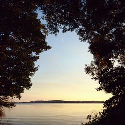 Scenic view of lake against sky during sunset