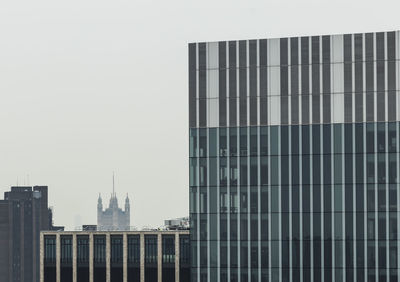Modern buildings against clear sky