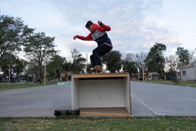 Portrait of skateboarder doing a trick