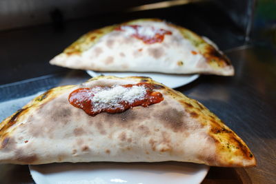 High angle view of pizza in plate on table