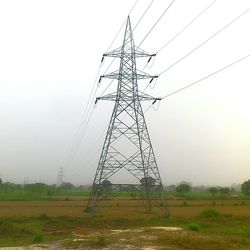 Electricity pylon on field