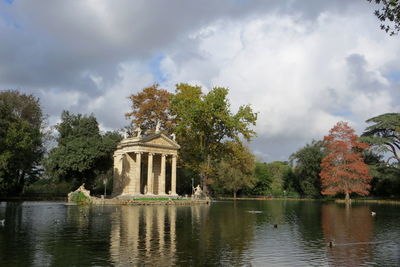 Scenic view of lake against cloudy sky