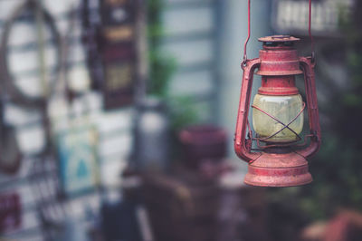 Close-up of old lantern hanging outdoors