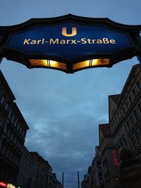 Low angle view of information sign in city