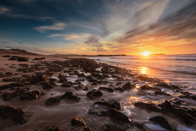 Scenic view of sea at sunset