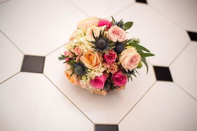 High angle view of rose bouquet on tiled floor