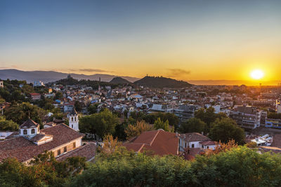 High angle view of townscape against sky at sunset