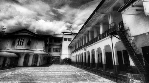 View of buildings against cloudy sky