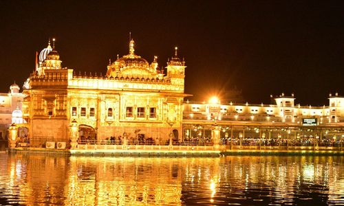 Reflection of illuminated buildings in water at night