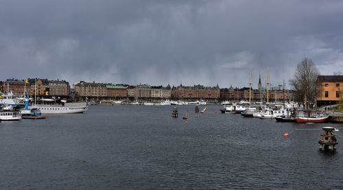 Panoramic view of boats moored at harbor