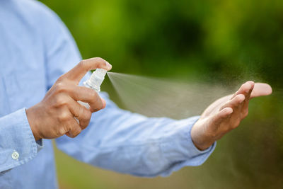 Close-up of man holding hands