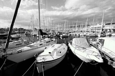 Boats moored at harbor