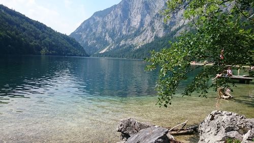 Scenic view of lake and mountains against sky