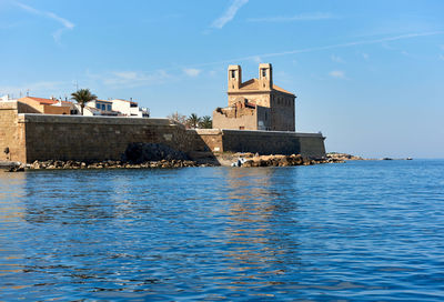 Scenic view of sea against blue sky