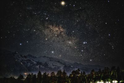 Scenic view of star field against sky at night