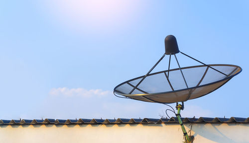 Sattellite dish communication industry on roof with blue sky background