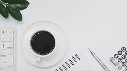 Directly above shot of coffee cup on table